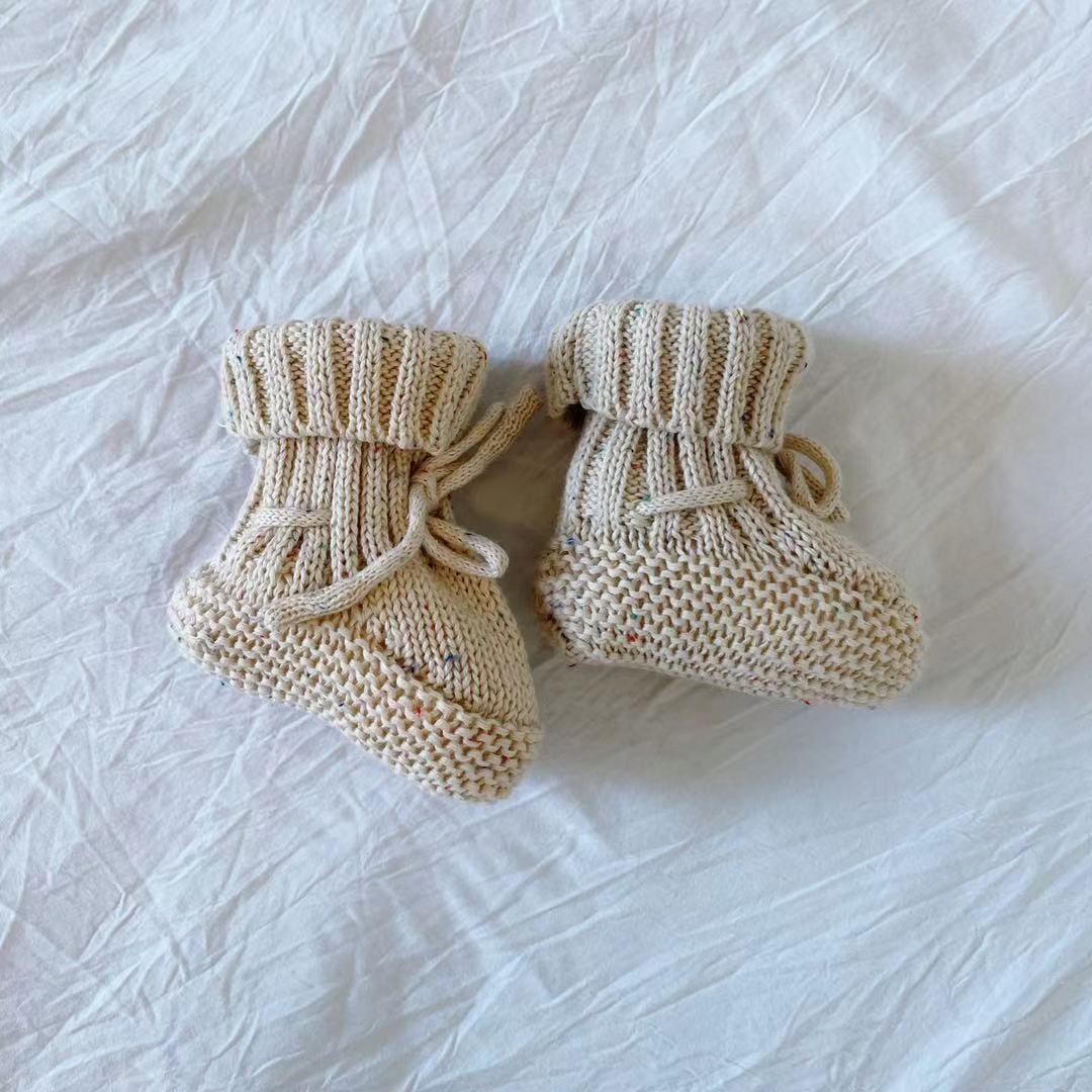 cream baby booties